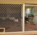 Diamond grill sliding door with pet flap
